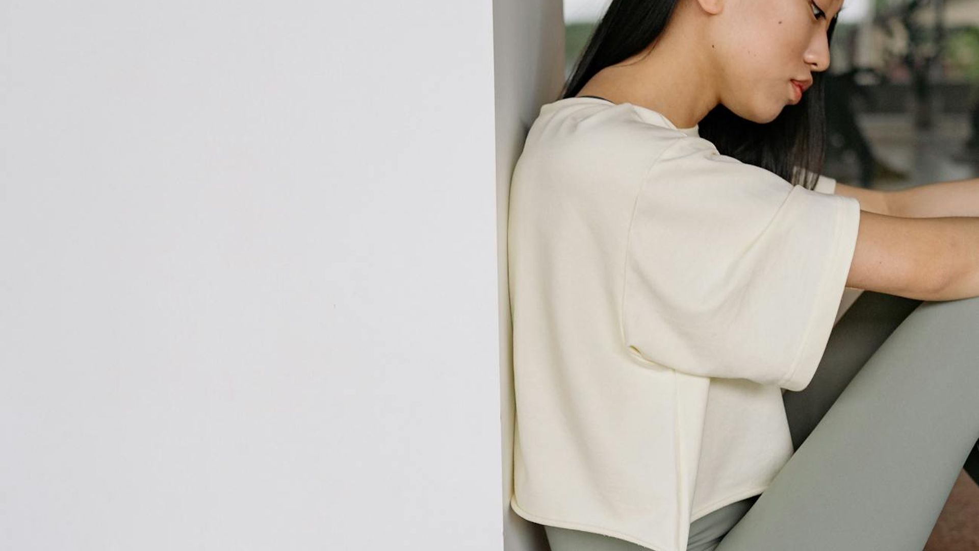 A serene, dark and minimalist space for practicing yoga.