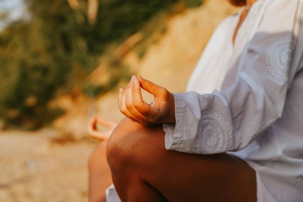Close-up of hands in a specific yoga mudra.